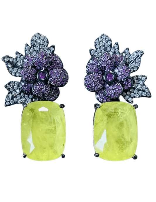 Pair of earrings with purple floral designs and yellow gemstones 
