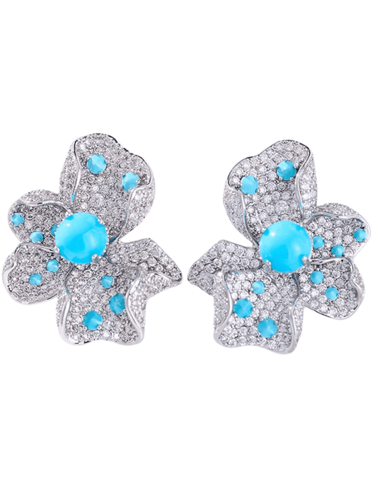 Fleur de Camélia Ella Flower Stud Earrings in silver-tone metal with blue gemstones.