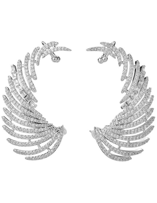 Feather-shaped earrings with diamond-like stones on a white background