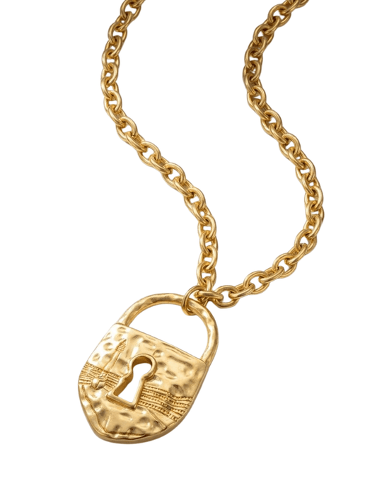 Close-up of etched gold padlock pendant with keyhole detail