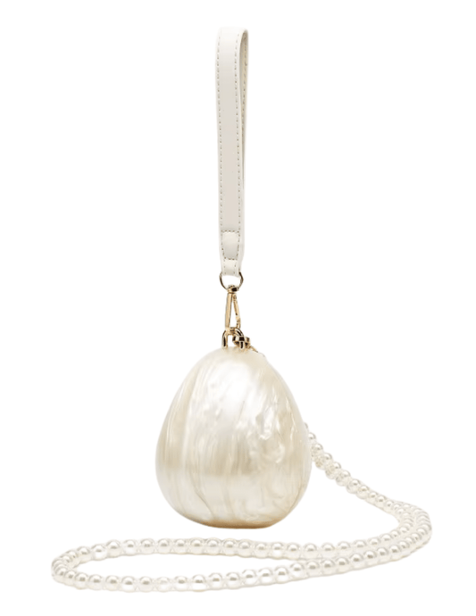 Ivory egg-shaped acrylic Lottie Mini Pearl Clutch with gold hardware and wrist strap