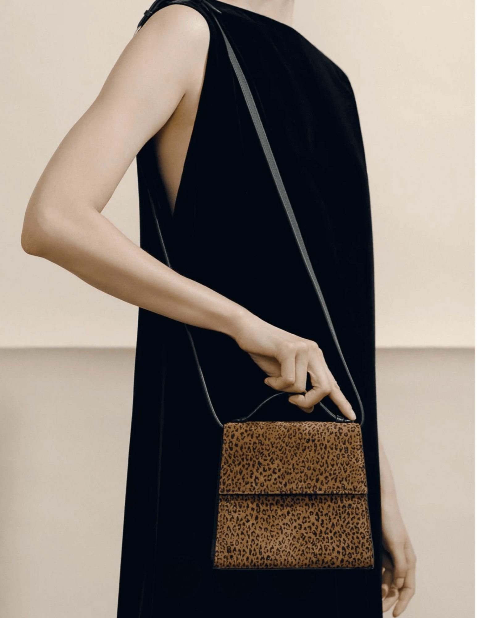 Hunting Season leopard-print suede handbag worn over the shoulder with adjustable strap