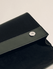 Interior detail of Hunting Season satin clutch with leather lining and magnetic closure