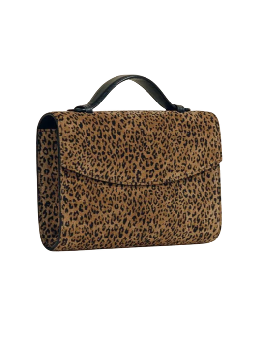 Angled view of Hunting Season animal print suede top handle clutch