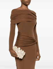 Model styling Cult Gaia Orbs Clutch in ivory acrylic with evening outfit