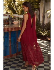 Back lifestyle view of L’AGENCE Adalynn Combination Pleated Maxi Dress in Black Cherry