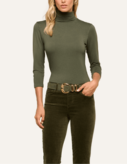 Model wearing L'AGENCE Aja Army Green Turtleneck with three-quarter sleeves and olive trousers.