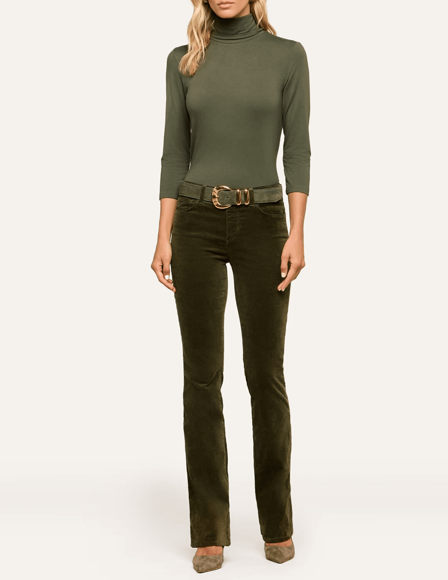 L'AGENCE Aja Turtleneck in Army Green styled with olive pants and a statement belt for a chic tonal outfit.