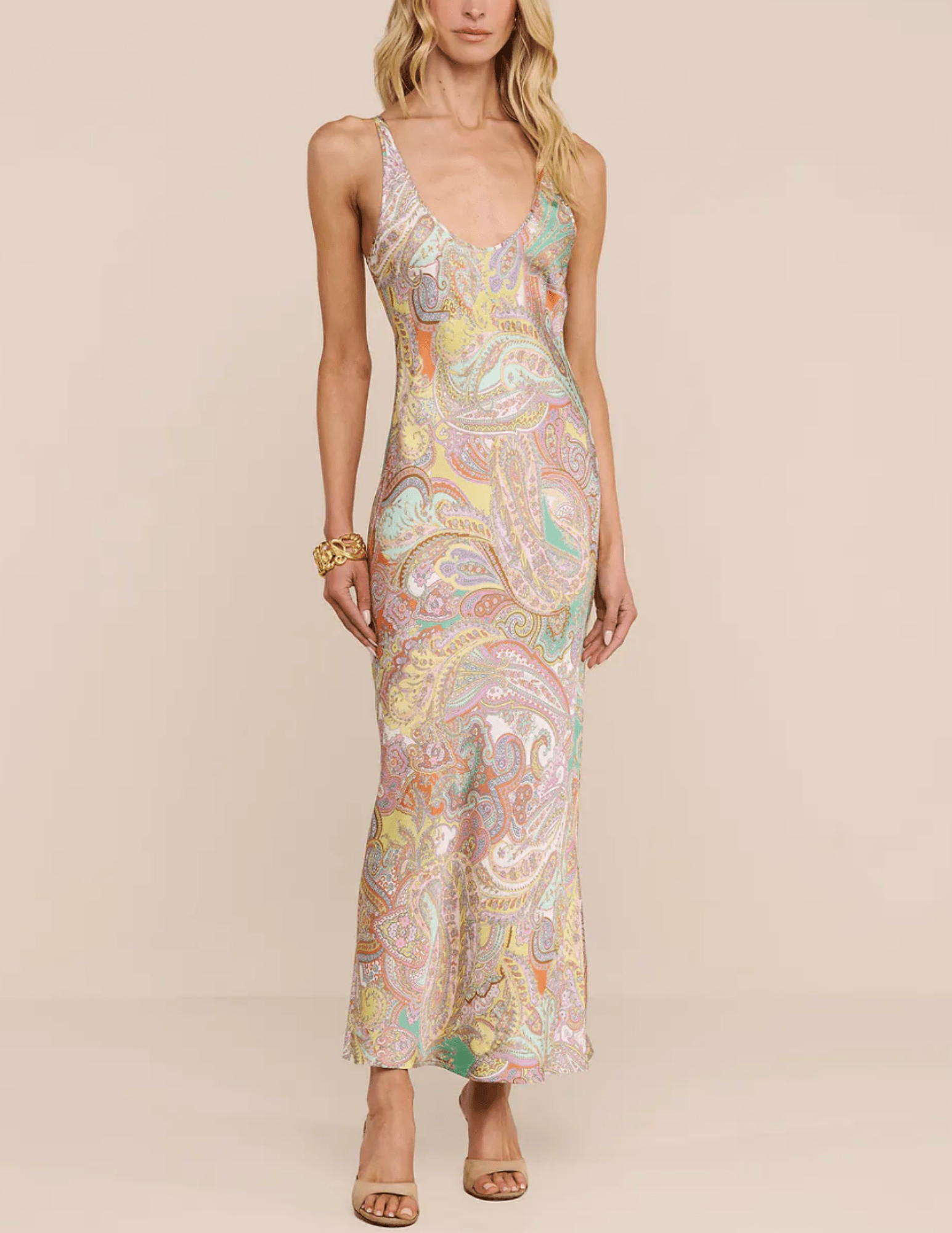 Model wearing L'AGENCE Akiya Green Multi Cluster Paisley maxi dress