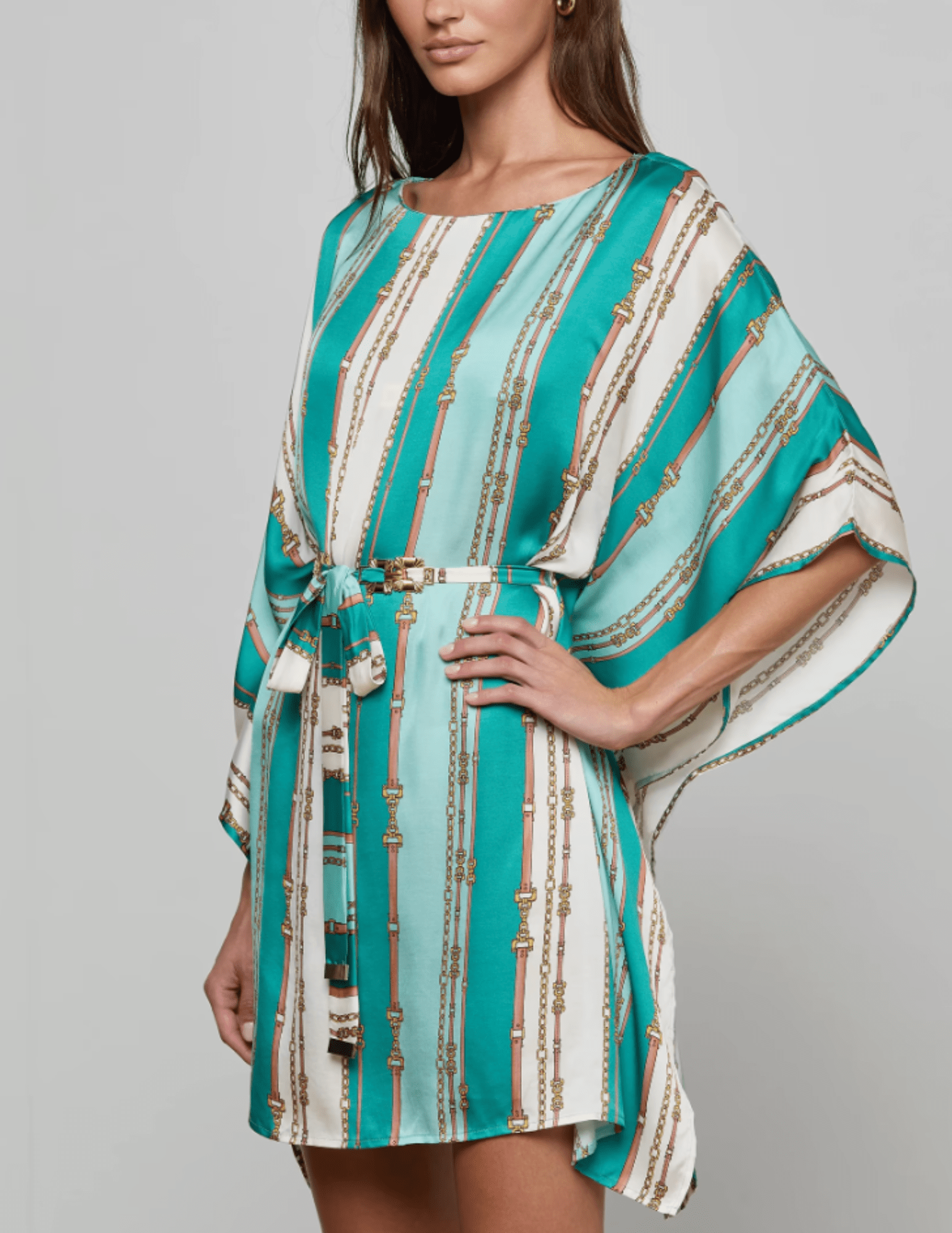 Side view of L’AGENCE Alia Cover-Up Tunic in Light Sage Belt Stripe on model