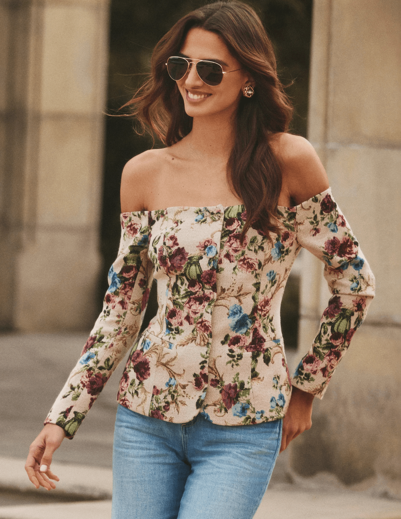 Model wearing L’AGENCE Alice off-shoulder floral tapestry blazer