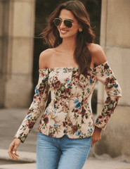 Model wearing L’AGENCE Alice off-shoulder floral tapestry blazer
