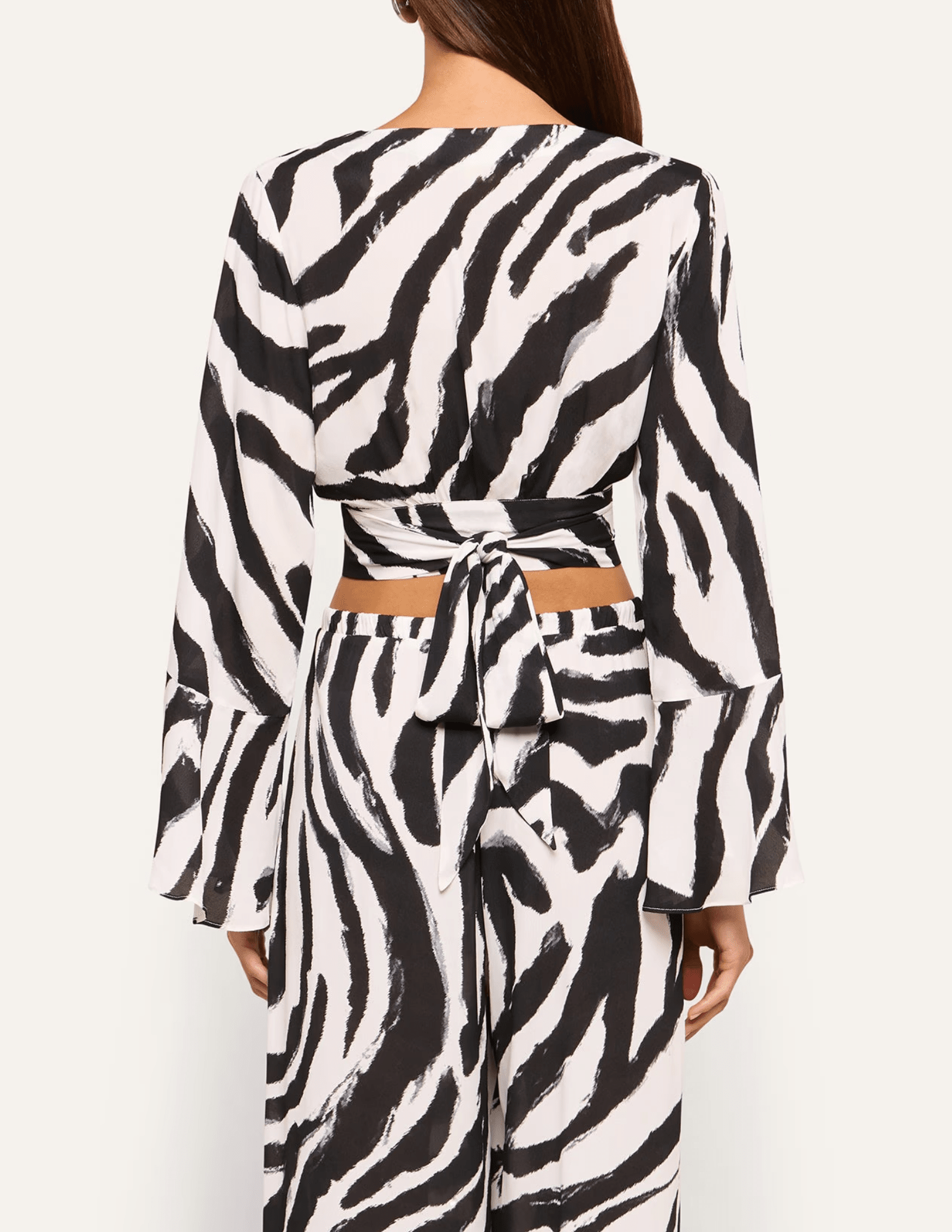 Back view of L'AGENCE Ambala black and white zebra print cover-up top.