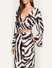Side view of L'AGENCE Ambala Cover-Up Top showcasing its wrap silhouette and long bell sleeves.