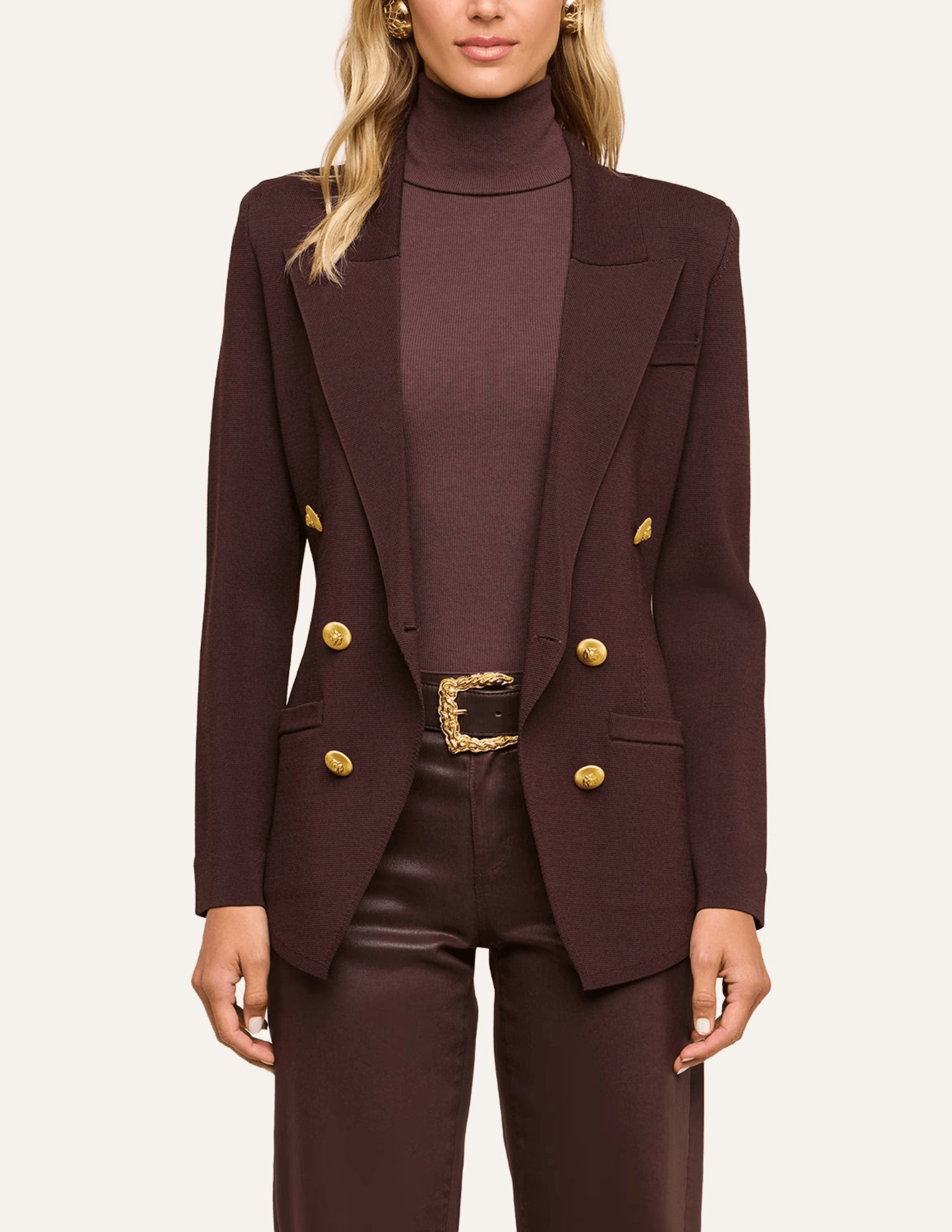 Model wearing L'AGENCE Amelia Knit Blazer in Dark Java and Gold.