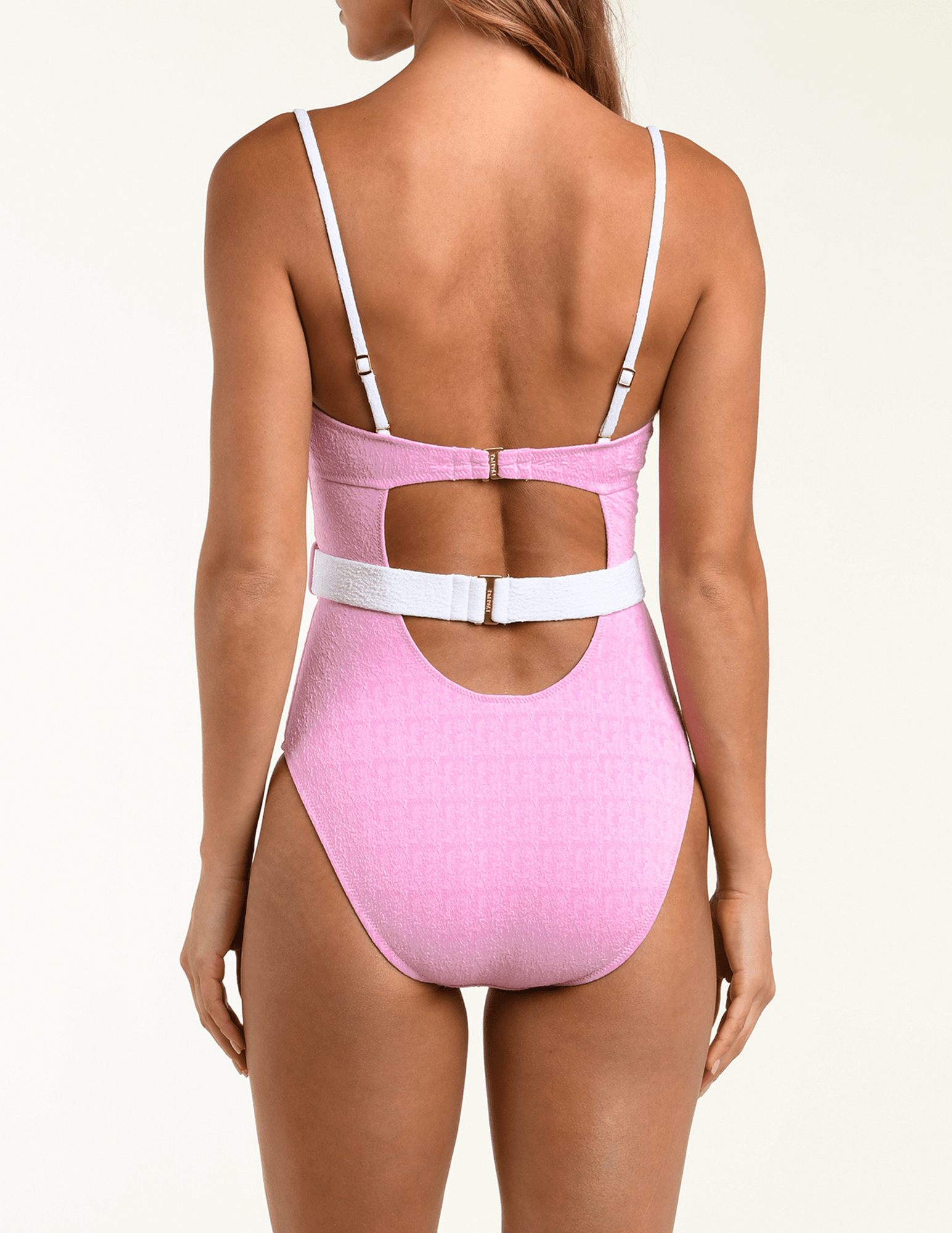 Back view of L’AGENCE Anastasia one-piece swimsuit in blush and white