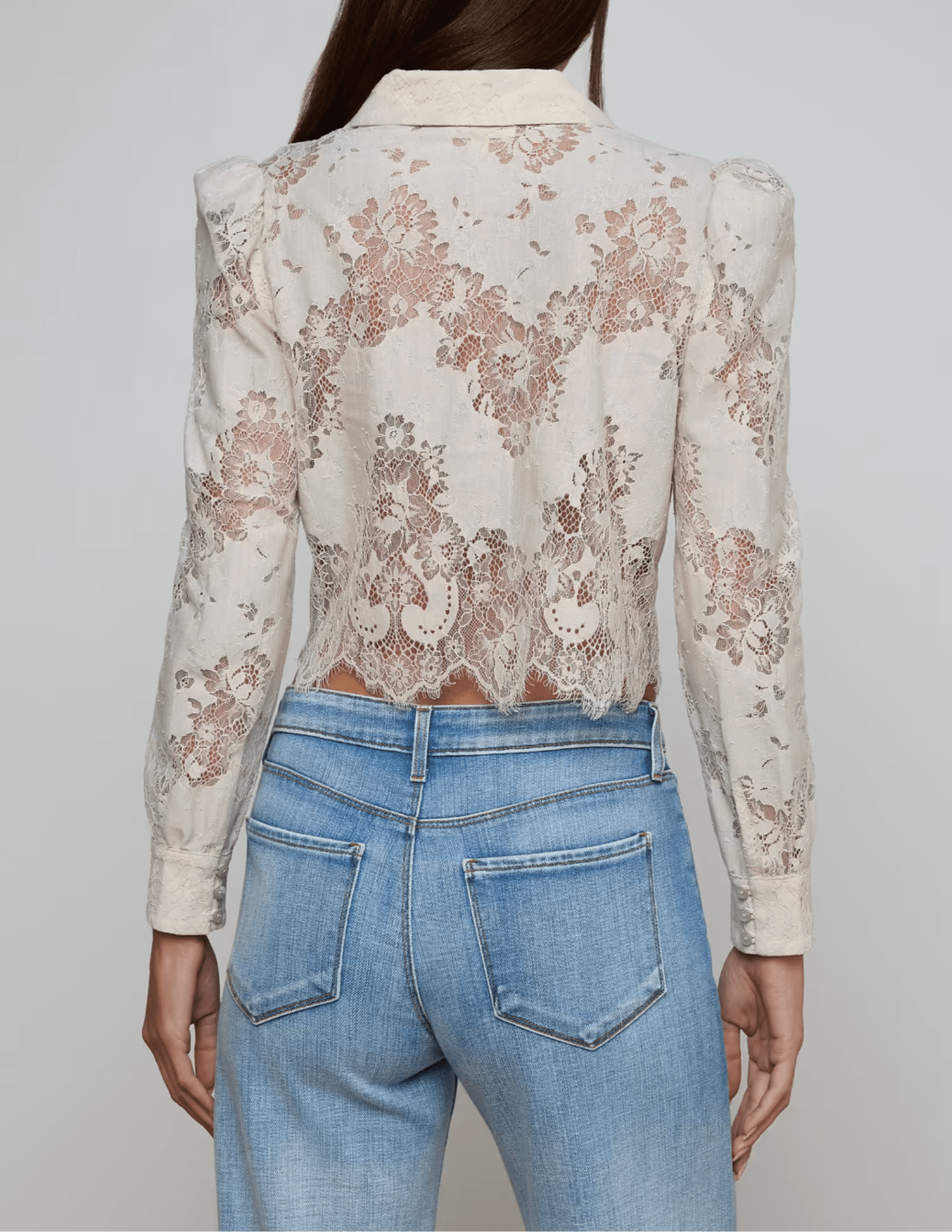 Back view of L’AGENCE Anita lace blouse with scalloped hem