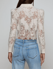 Back view of L’AGENCE Anita lace blouse with scalloped hem