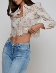 Side view of L’AGENCE Anita lace blouse with scalloped hem