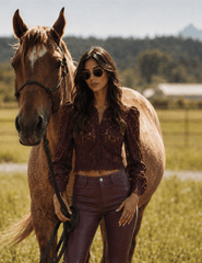 Lifestyle image of L'AGENCE Anita Lace Cropped Blouse in Deep Sangria