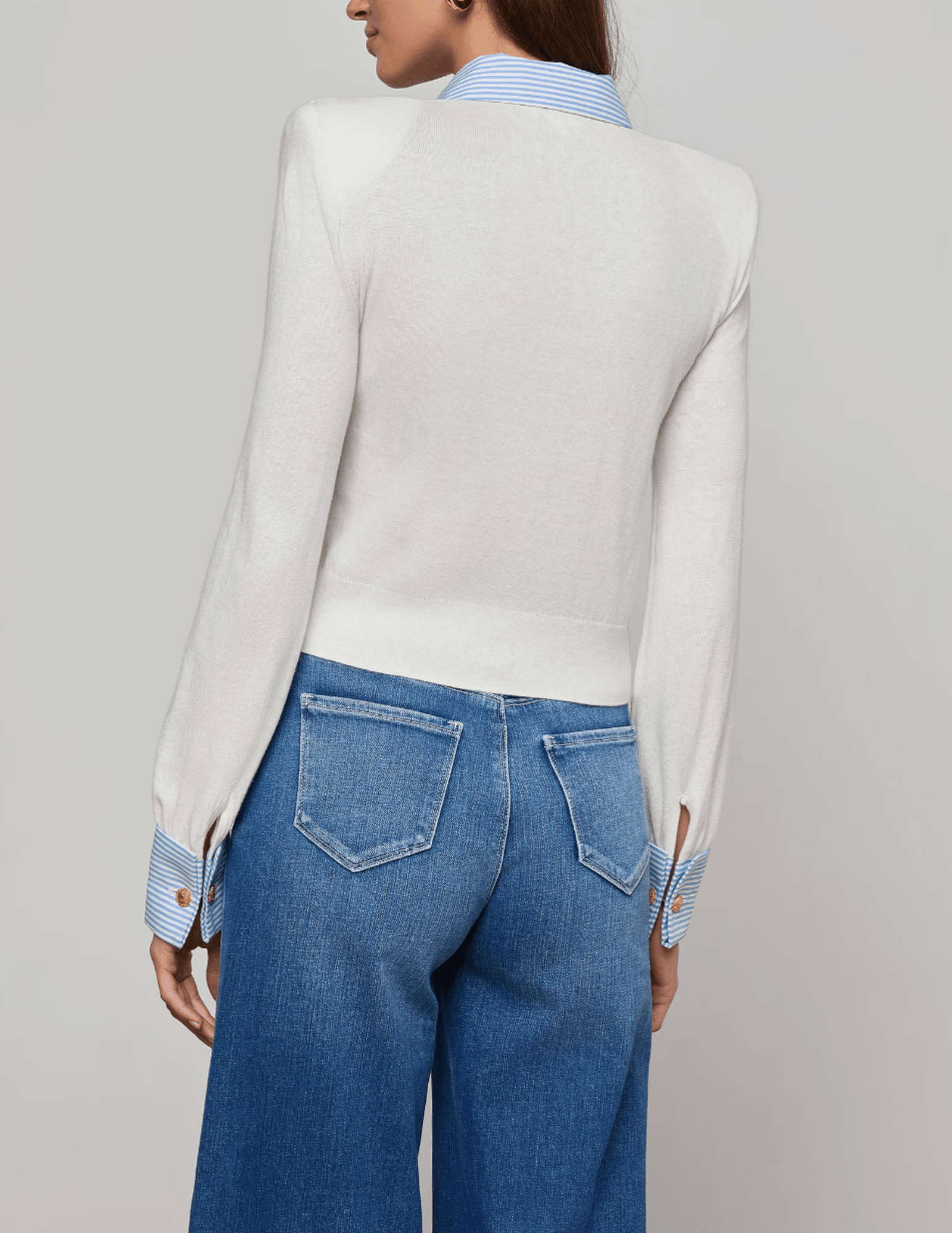Back view of white and blue striped poplin collar knit sweater