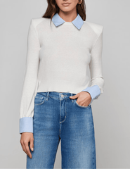 Model wearing white slim-fit poplin collar sweater with French cuffs by L’AGENCE