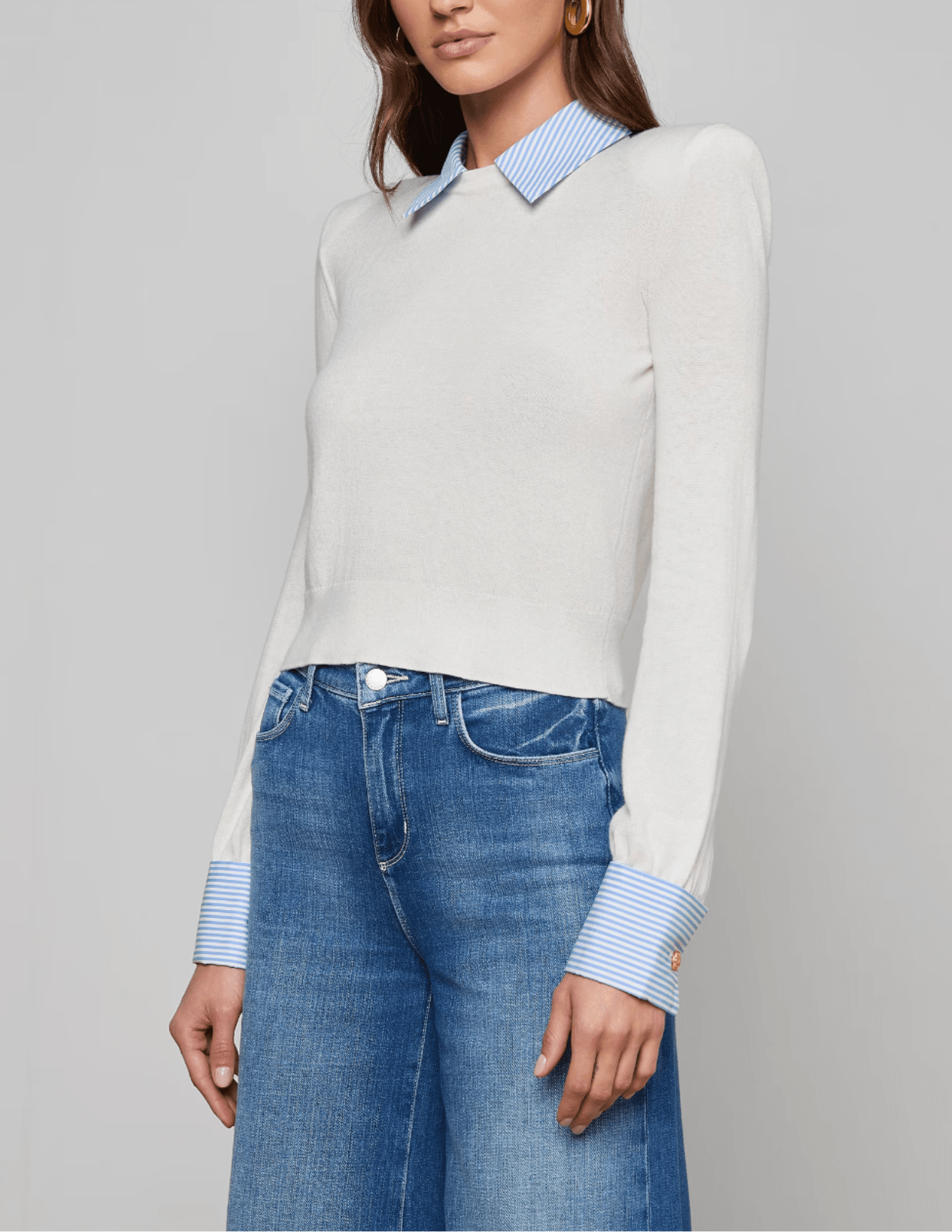 Side view of L’AGENCE April sweater with tailored French cuffs and poplin collar