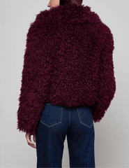 Back view of L’AGENCE Aura Crop Faux Fur Jacket in Primitivo.”