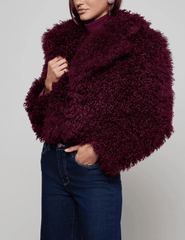 Side view of L’AGENCE Aura Crop Faux Fur Jacket in Primitivo.”