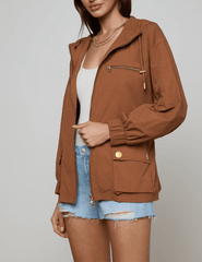 Side view of L’AGENCE Calina windbreaker jacket in fawn with gold hardware