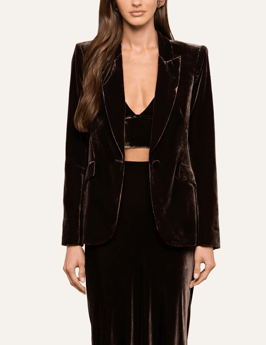 Model wearing L'AGENCE Chamberlain dark brown velvet blazer with tailored silhouette
