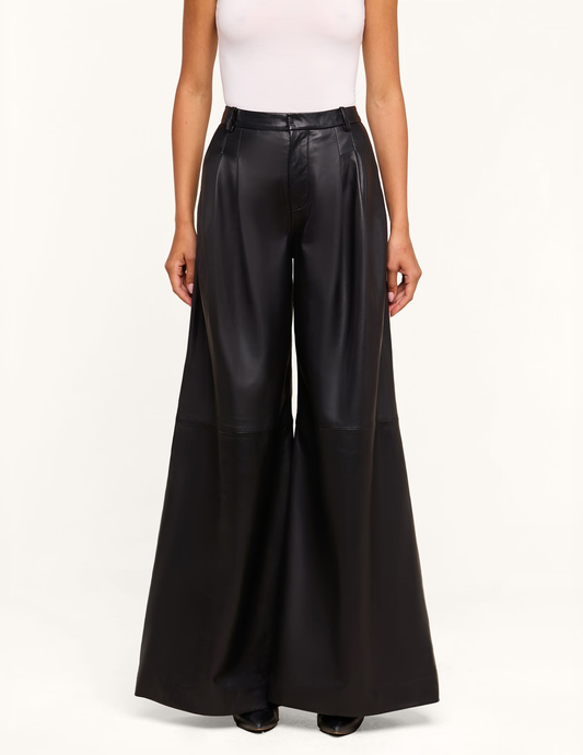 Front view of model wearing L'AGENCE Chelsy Black Leather Wide Leg Pants with dramatic wide-leg silhouette.