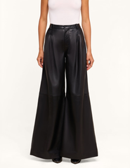 Front view of model wearing L'AGENCE Chelsy Black Leather Wide Leg Pants with dramatic wide-leg silhouette.