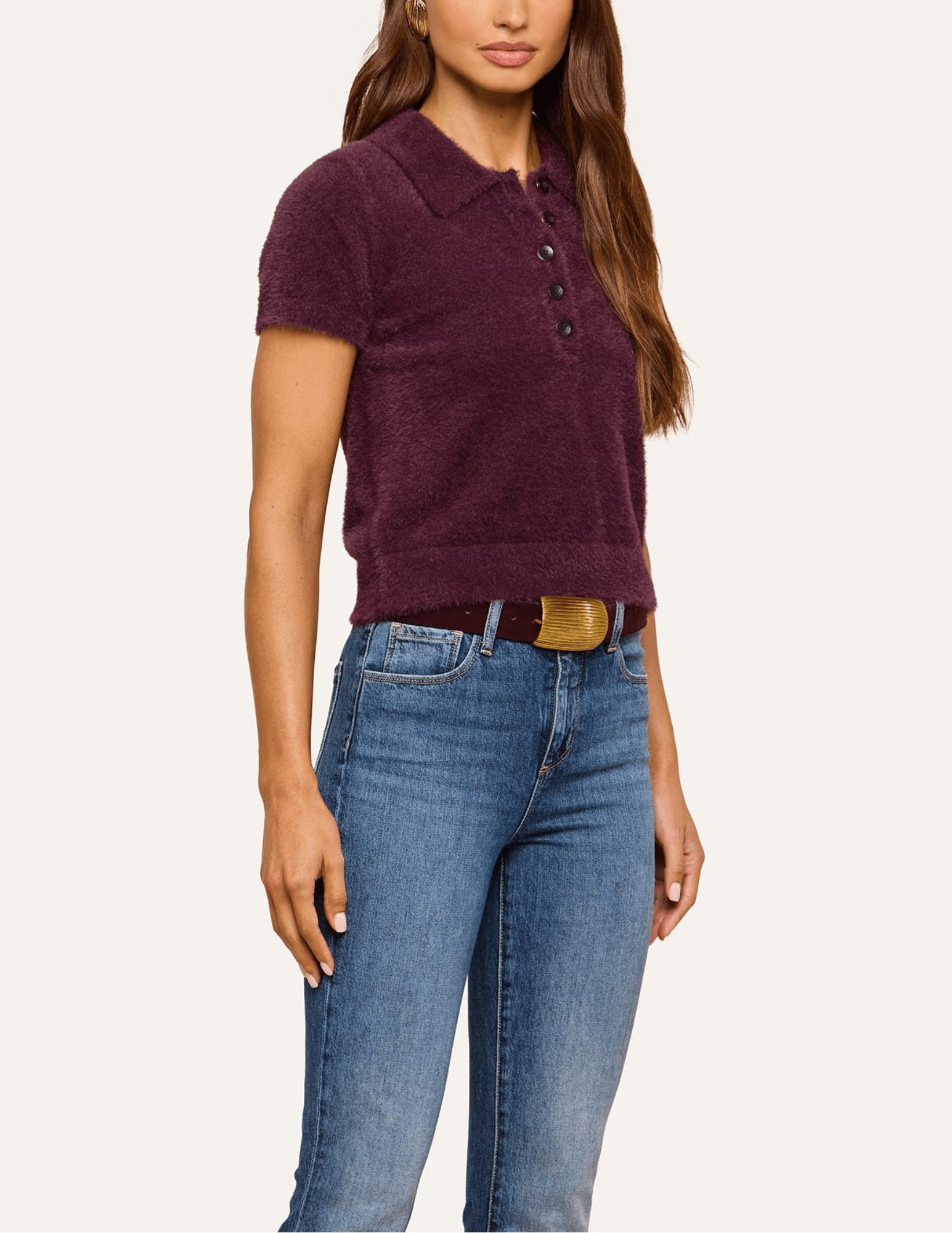 Side view of L'AGENCE Cirrus Short Sleeve Cropped Polo in Dark Plum showing the plush knit texture and cropped hem.