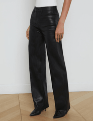 L'AGENCE Clayton high rise wide leg coated jeans in Black Coated, sleek women’s denim with a glossy finish and relaxed wide leg silhouette side model view