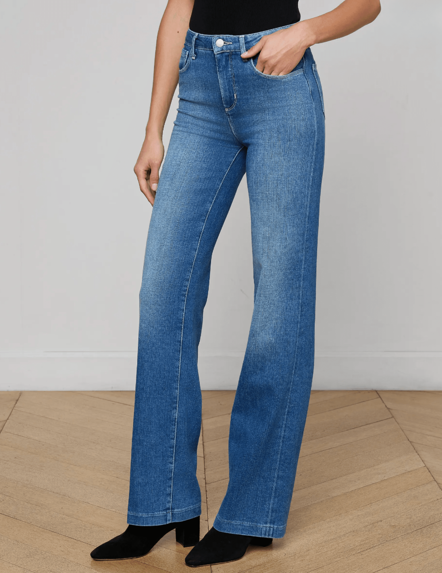 Side view of L’AGENCE Clayton wide leg jeans with contoured waistband