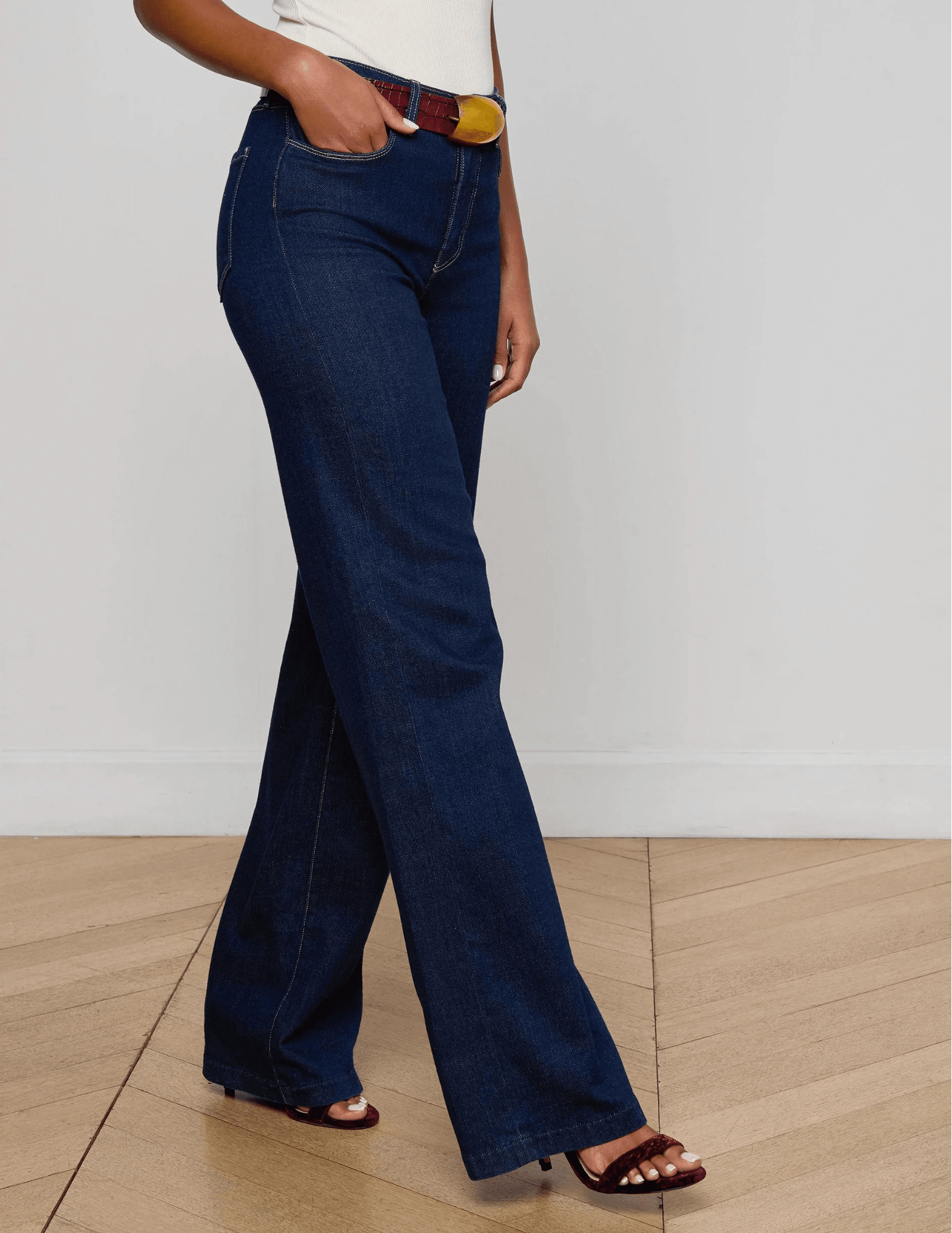 Side view of L’AGENCE Clayton Wide Leg Jeans in medium-blue Koval wash.