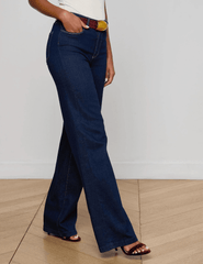 Side view of L’AGENCE Clayton Wide Leg Jeans in medium-blue Koval wash.