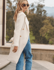 Model wearing L’AGENCE Cooper knee-length tweed trench coat