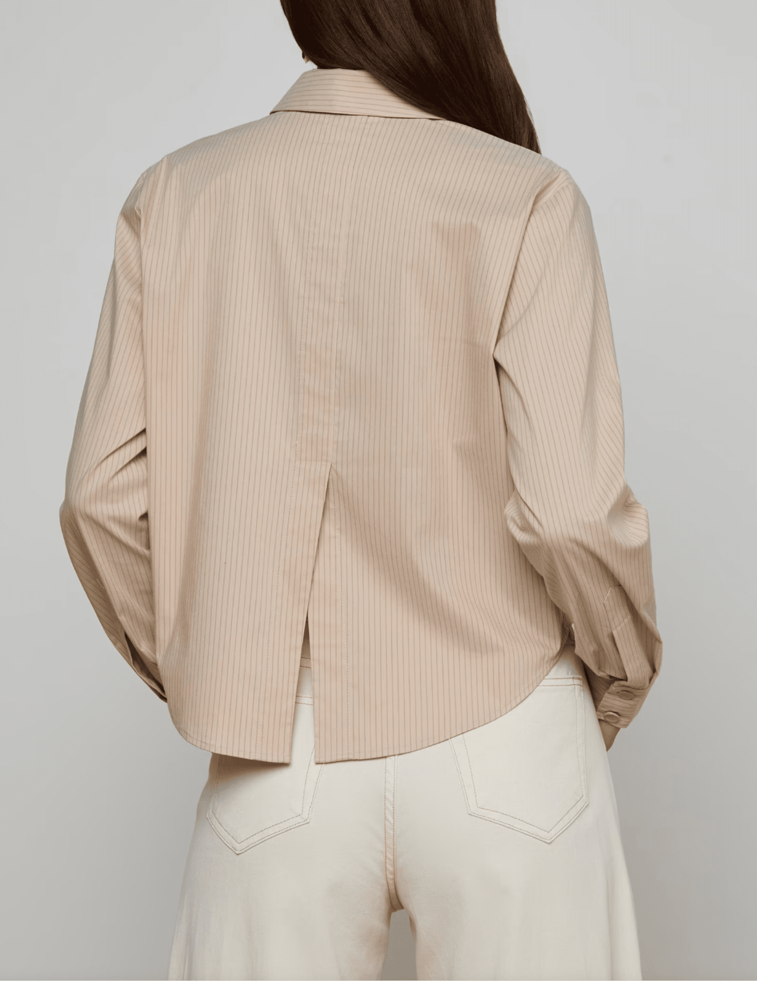 Back view of L’AGENCE Cosette blouse with vent detail