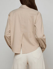 Back view of L’AGENCE Cosette blouse with vent detail