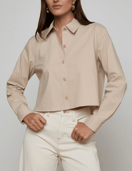 Front view of L’AGENCE Cosette blouse with vent detail