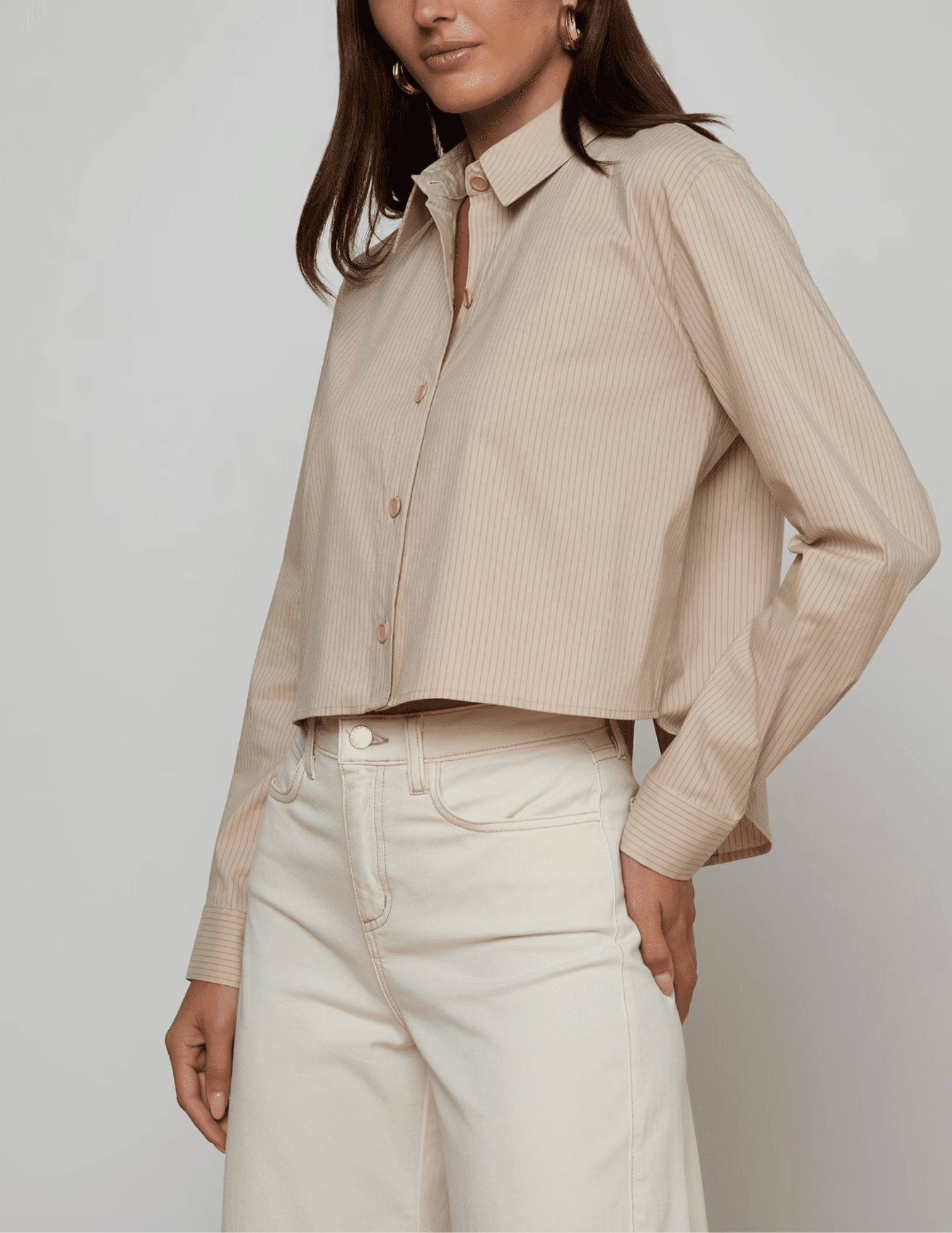 Side view of L’AGENCE Cosette blouse with vent detail