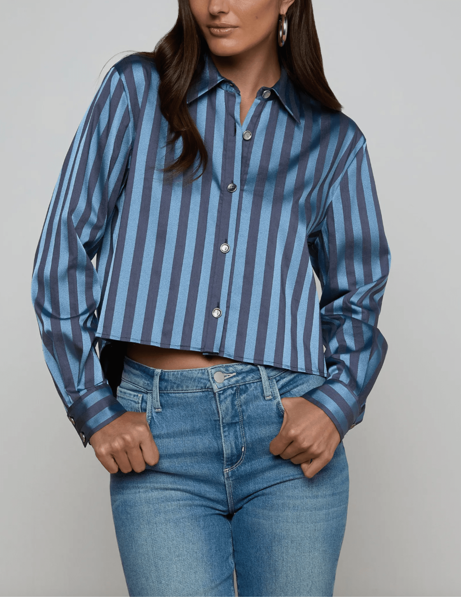 Front view of blue striped satin high-low blouse