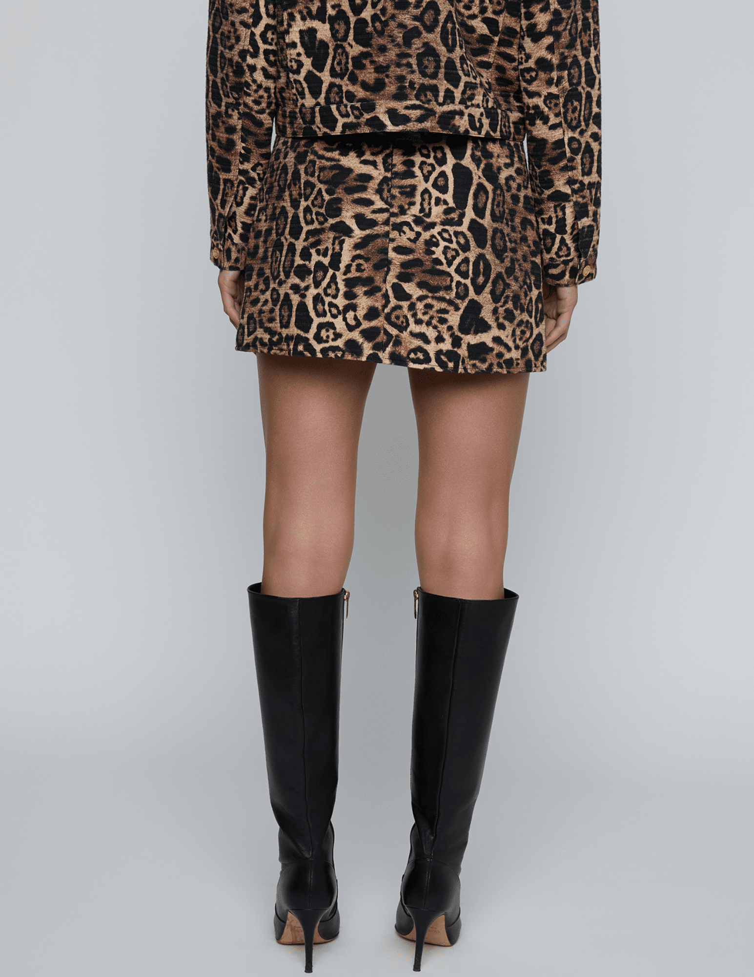 Back view of L’AGENCE Cyra Leopard Print Mini Skirt in 100% cotton.