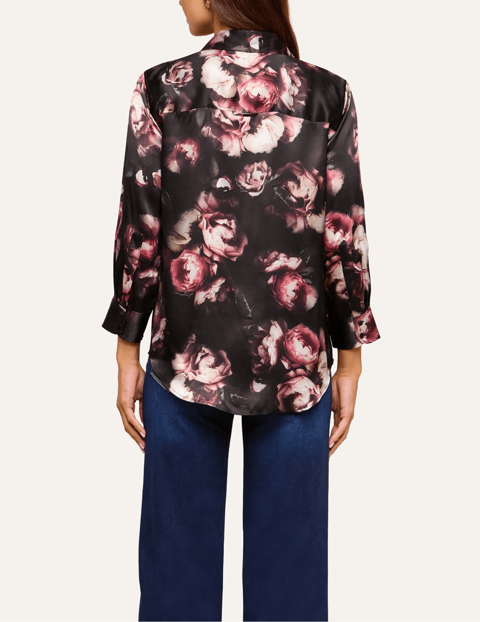 Back view of L'AGENCE Dani floral silk blouse showcasing its high-low shirttail hem and romantic distressed rose pattern.