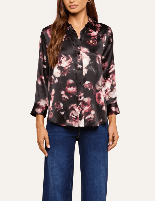 Front view of L'AGENCE Dani floral silk blouse showcasing its high-low shirttail hem and romantic distressed rose pattern.