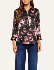 Front view of L'AGENCE Dani floral silk blouse showcasing its high-low shirttail hem and romantic distressed rose pattern.