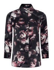 L'AGENCE Dani floral silk blouse showcasing its high-low shirttail hem and romantic distressed rose pattern.