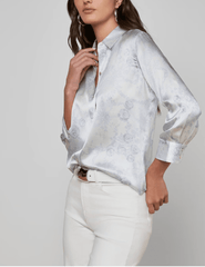 Side view of L'AGENCE Dani Three Quarter Sleeve Blouse in Ivory Pale Mist Blue Lace Print 